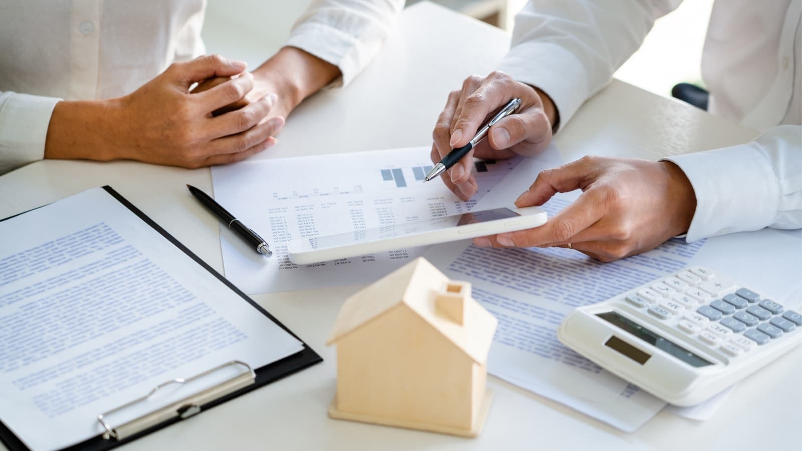Estate agent showing a property to prospective buyers